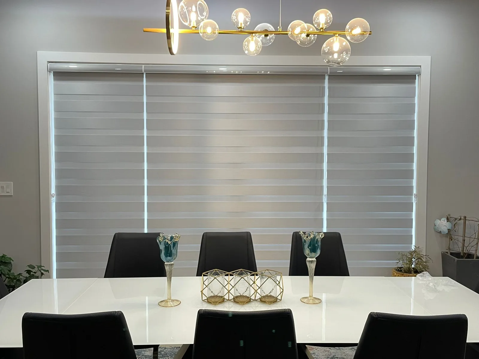 Three-piece light-filtering zebra blinds across a wide patio door in Edmonton
